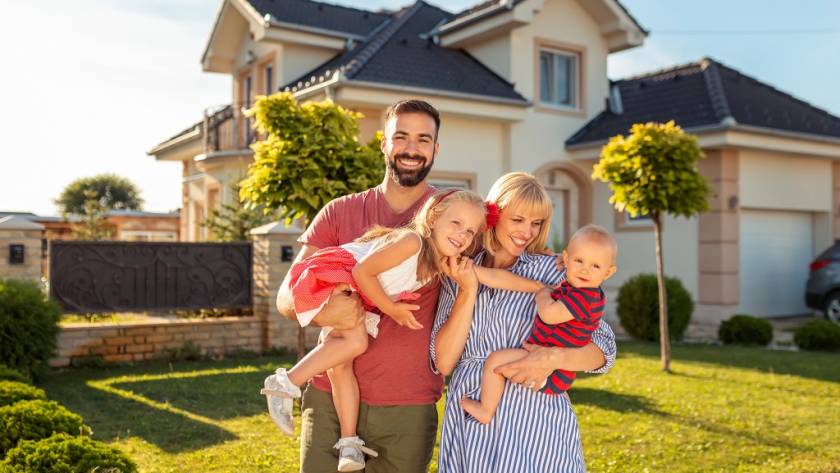 family standing in front of their new house 2025 03 13 11 47 08 utc